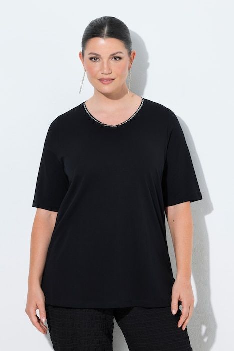 T-shirt à coupe évasée. Col en V et manches courtes