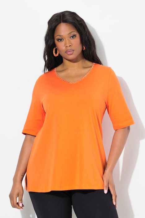 T-shirt à coupe évasée. Col en V et manches courtes