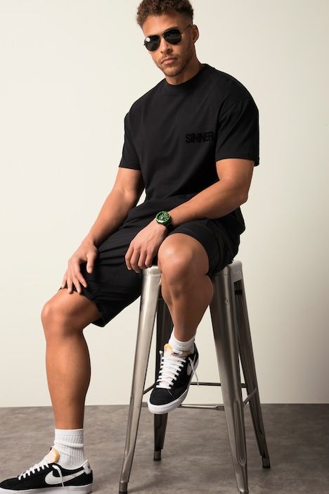 T-shirt oversized. Col rond, manches courtes et imprimé floqué. Jusqu'au 8XL