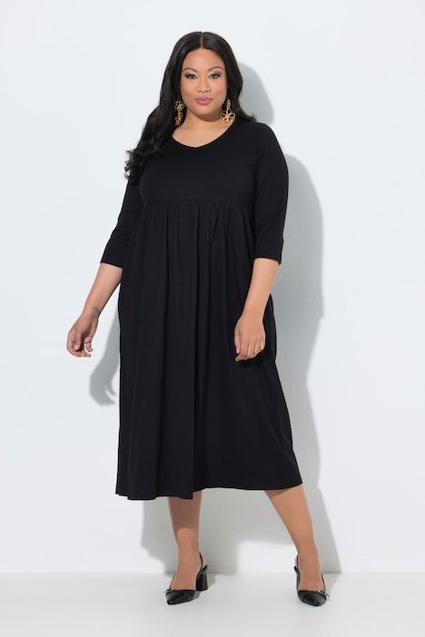 Robe en jersey avec poches, couture empire, décolleté en V et manches 3/4