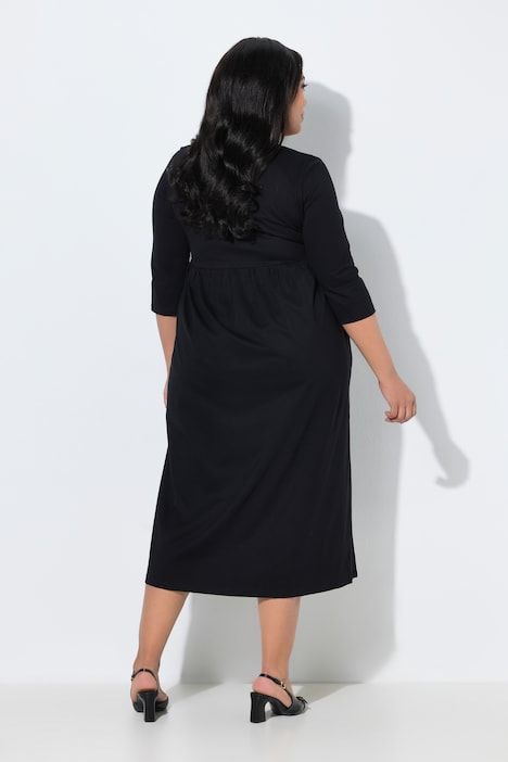 Robe en jersey avec poches, couture empire, décolleté en V et manches 3/4