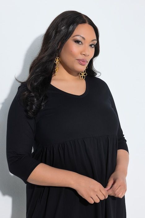 Robe en jersey avec poches, couture empire, décolleté en V et manches 3/4