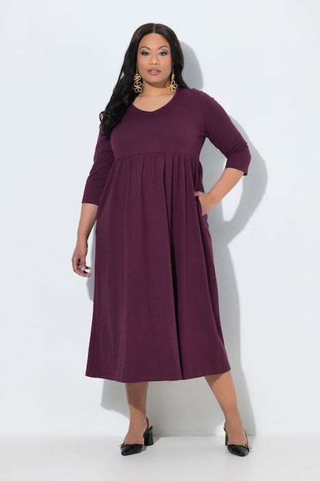 Robe en jersey avec poches, couture empire, décolleté en V et manches 3/4