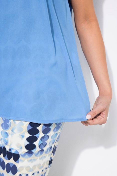 T-shirt sans manches. Mélange de matières et strass. Col rond