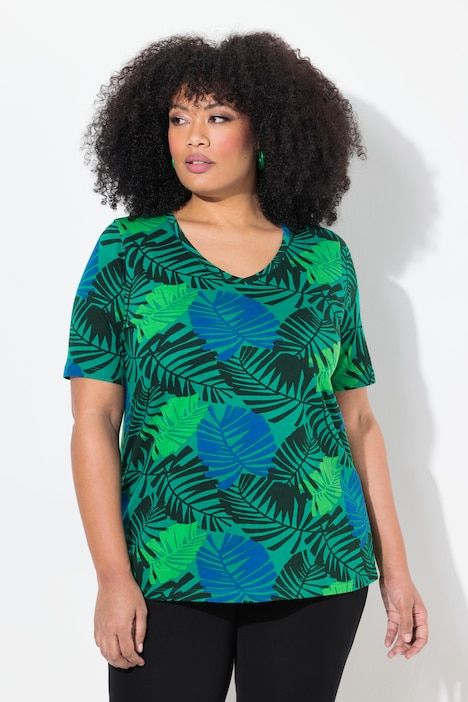 T-shirt, imprimé fleurs et feuilles. Décolleté V et manches courtes. Coupe évasée