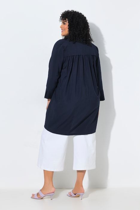 Veste à bouton-pression. Décolleté V et manches 7/8