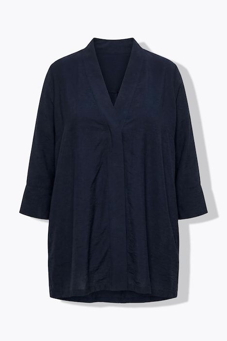 Veste à bouton-pression. Décolleté V et manches 7/8