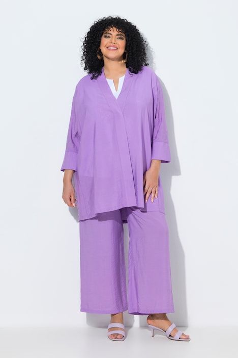 Veste à bouton-pression. Décolleté V et manches 7/8