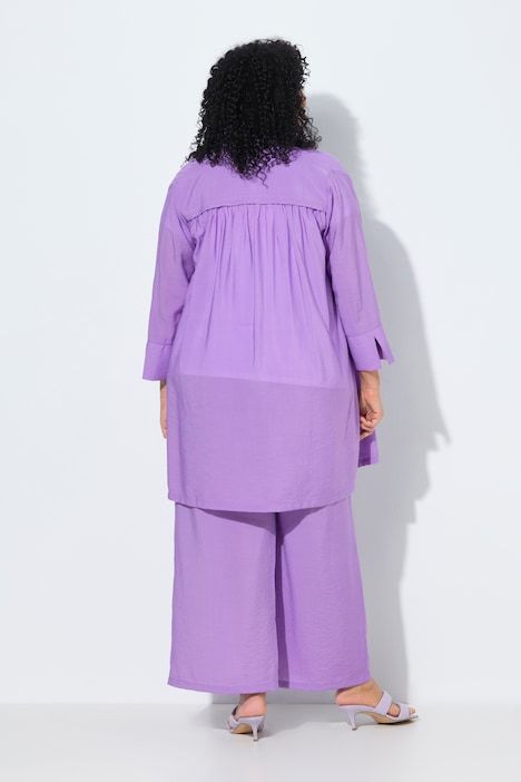 Veste à bouton-pression. Décolleté V et manches 7/8