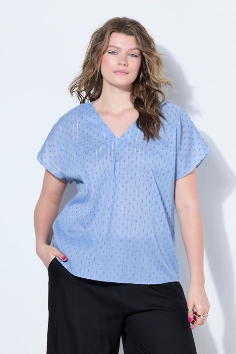 Blouse oversize, texture et paillettes