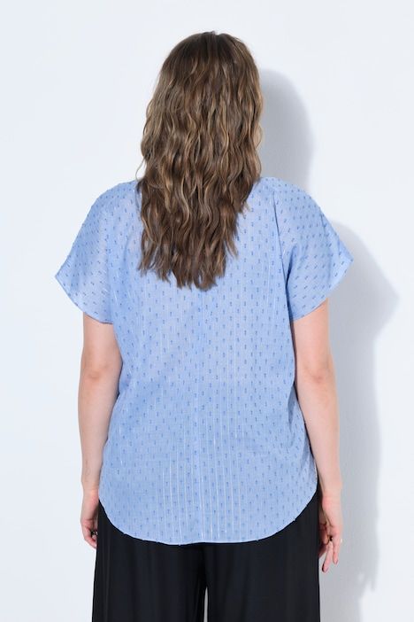 Blouse oversize, texture et paillettes