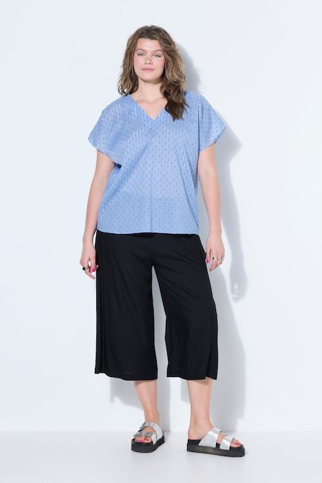 Blouse oversize, texture et paillettes