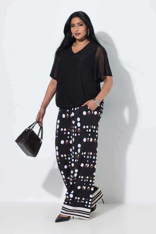 Pantalon au tombé fluide, motif à pois, jambe large et taille élastique
