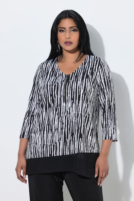 T-shirt rayé au tombé fluide, décolleté en V et manches 3/4, coupe évasée