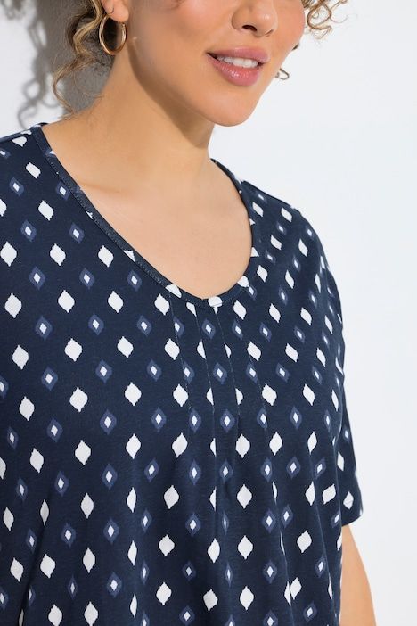 T-shirt avec passepoils, décolleté en V et manches courtes, coupe évasée